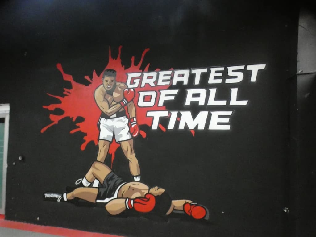 Muhammed Ali resmi ve 'Greatest of All Time' duvar yazısı